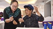 Feature: From China's mountain heartlands to global spotlight, Yi embroidery travels far
