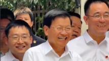 Lao president tries Chinese-made quadruped robot