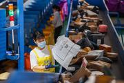 China's postal industry sees stable growth in Jan-Nov