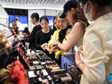 Customers shop at duty-free shopping mall in Sanya, China's Hainan